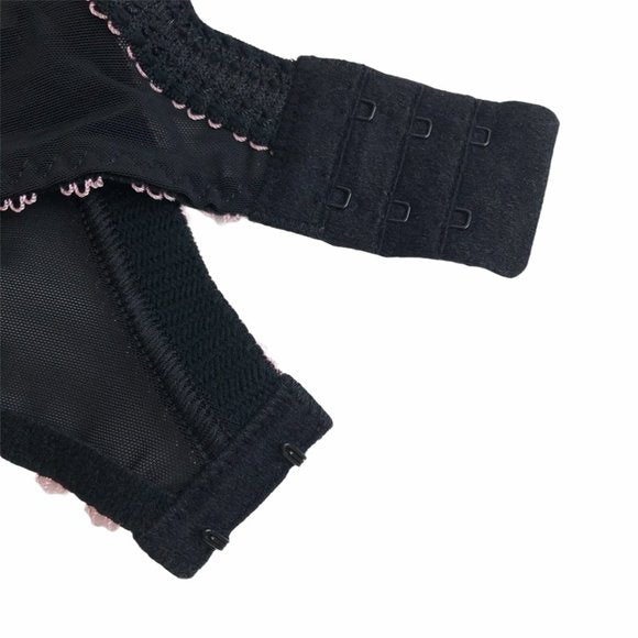 Close-up of Arabella bra’s 2-row, 3-column hook-and-eye back closure in black mesh